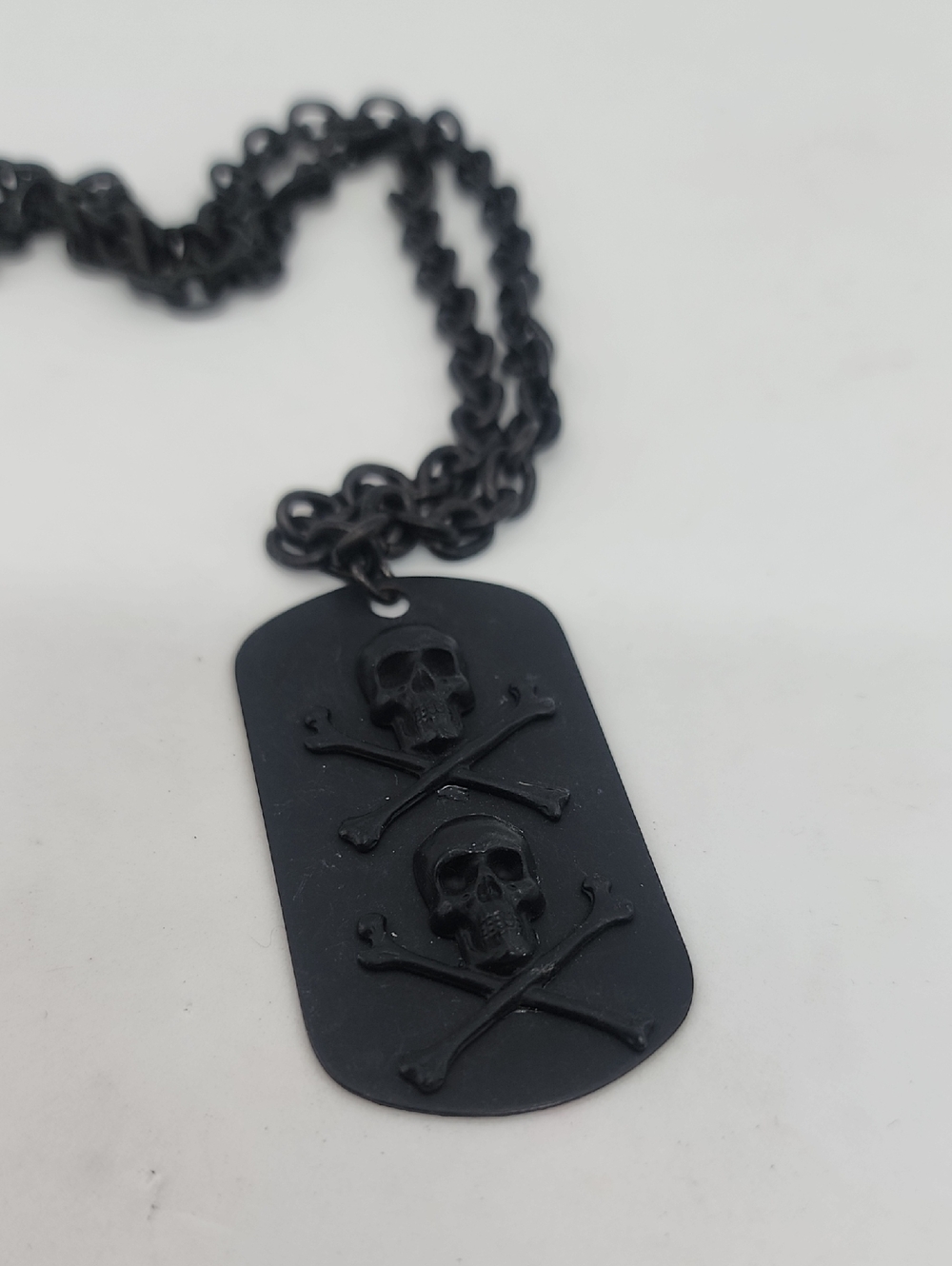 FLAT BLACK DOUBLE SKULLS DOG TAG WITH CHAIN SHOWN